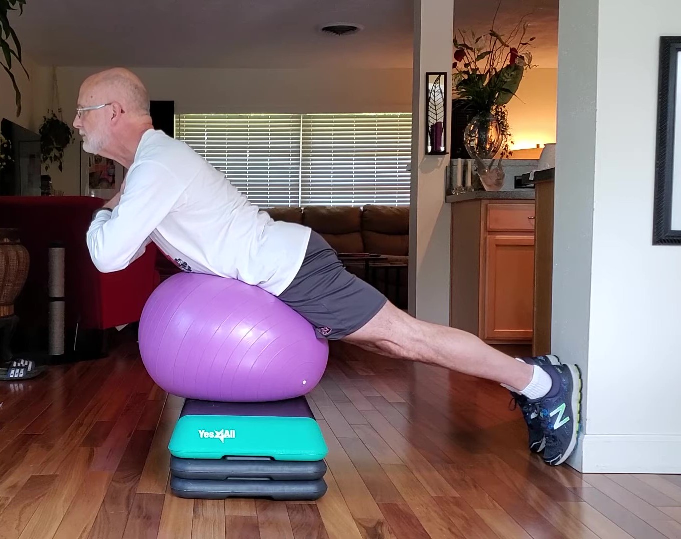What strength training routine should you be doing at 50? Shown: back extension on physioball