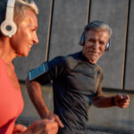 Older couple running together - strength training for runners over 50