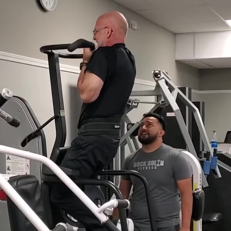 Dave Durell from Strength After 50 performing a chin up as part of an advanced workout routine.