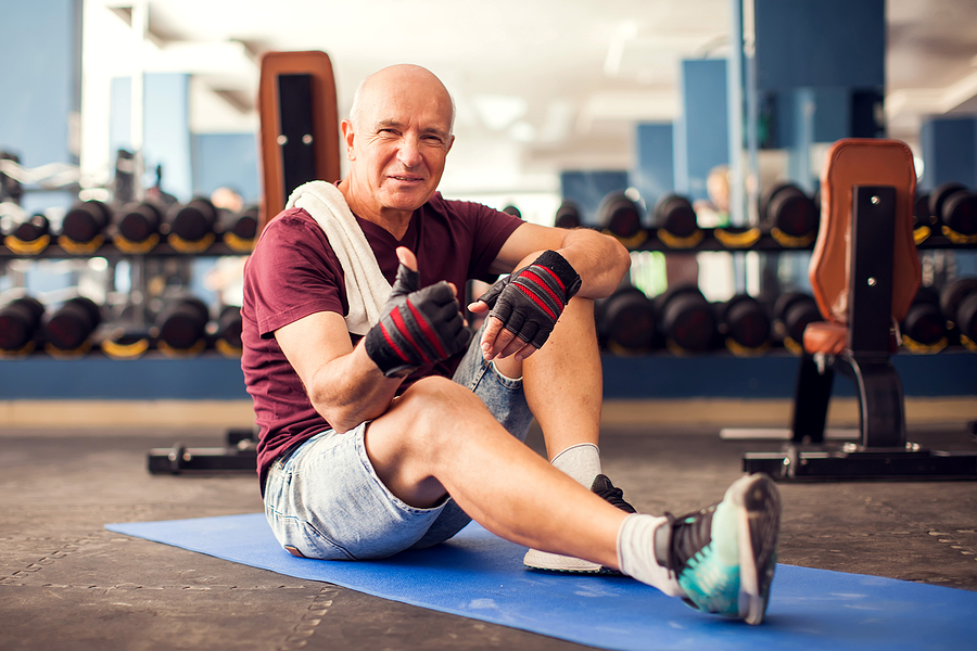 Senior Man In The Gym giving thumbs up after a strength training for seniors workout