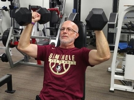 build more muscle after 50 - seated dumbbell shoulder press